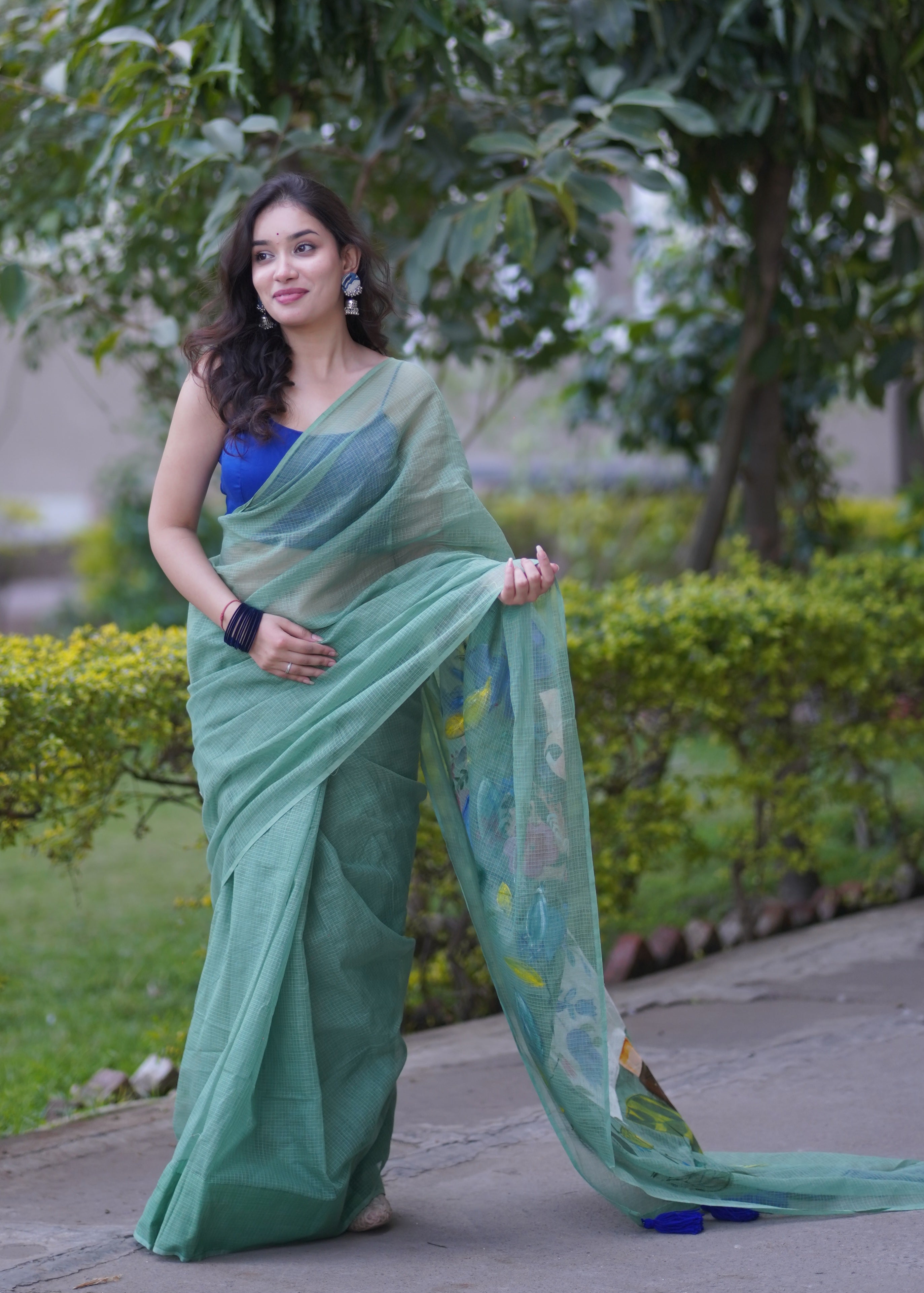 Whispering Wines- Green Handpainted Kota Saree