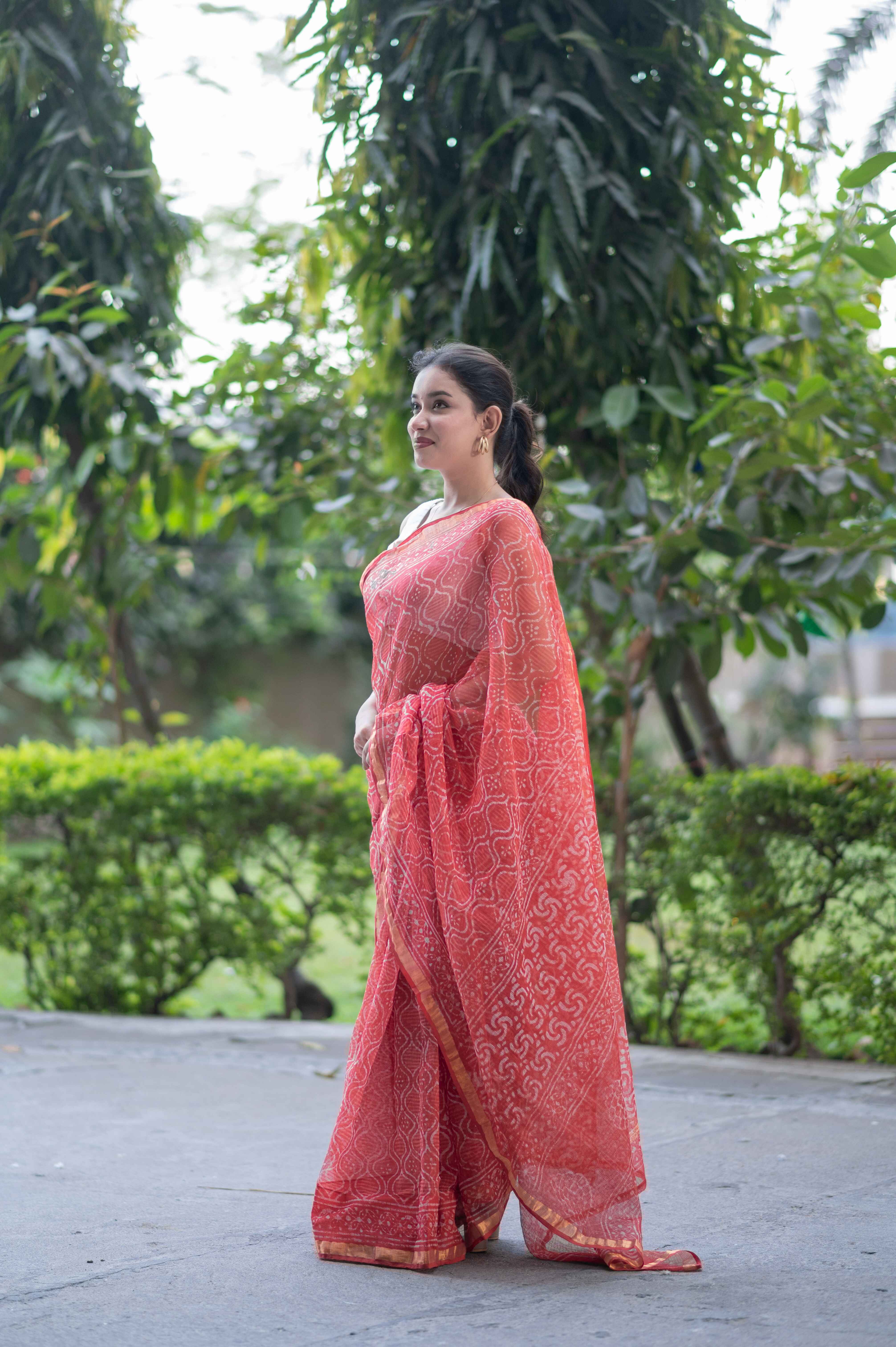 Sage Whisper - Orange Dabu Kota Doria Saree